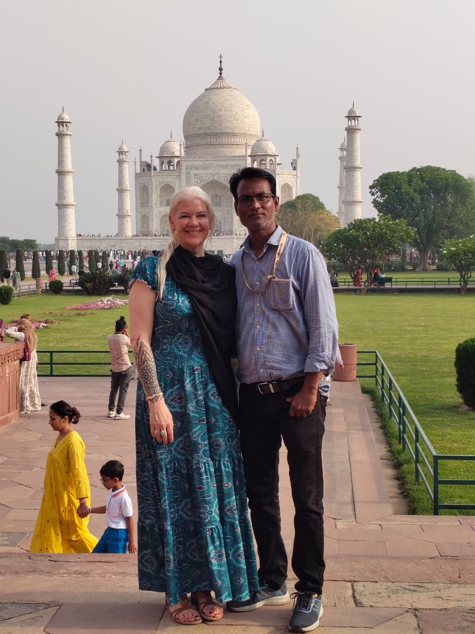 Mr. Verma with tourists smiling